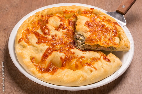 Khachapuri with meat and cilantro beef, sulguni, onion