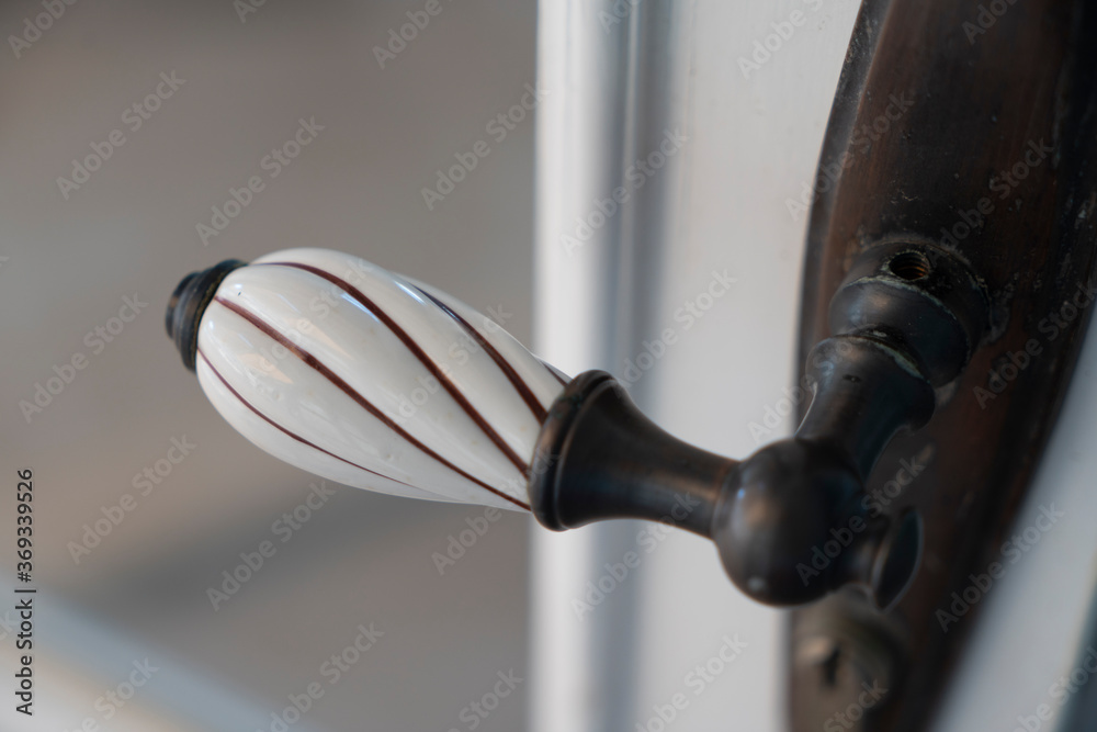 old wooden entrance door with antique door handle old wooden entrance door with antique door handle