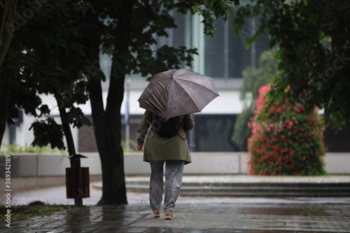 woman walking in rain