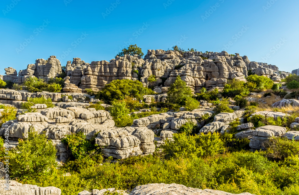 A multi-level ridge of weathered limestone in the Karst landscape of El Torcal near to Antequera, Spain in the summertime
