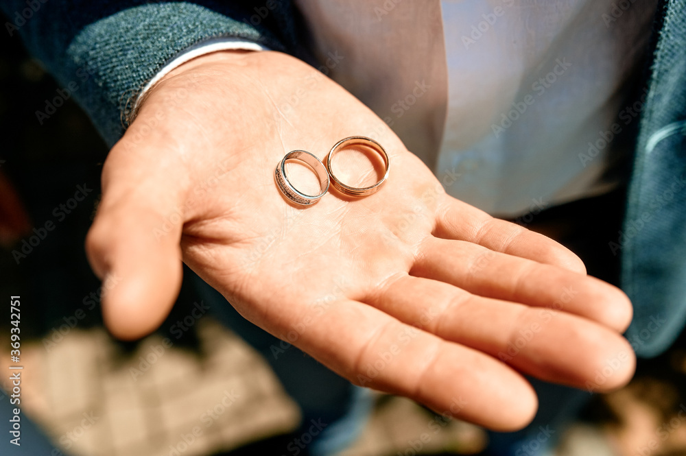 wedding rings on hands of groom wedding rings on hands of groom