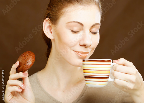 woman with coffee and cookies