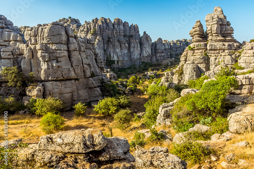 A view over the pathway through the weathered limestone in the Karst landscape of El Torcal near to Antequera, Spain in the summertime