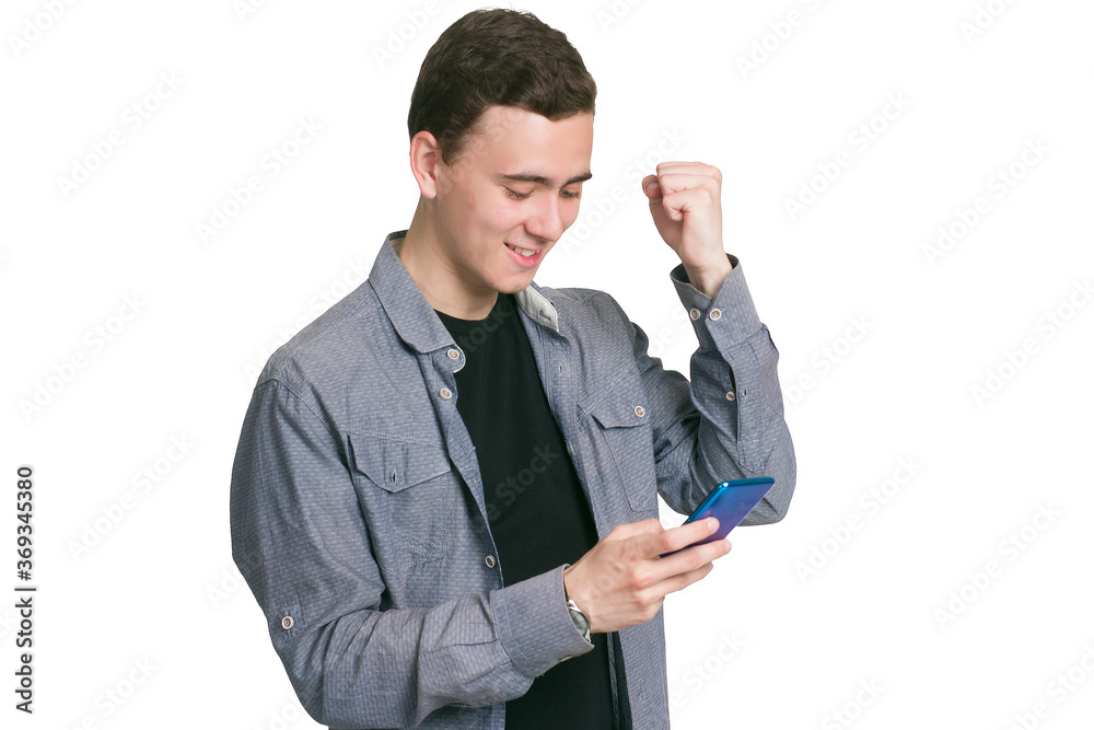 A young man in a Manatee shirt, black t-shirt and trousers, isolated on white A young man in a Manatee shirt, black t-shirt and trousers, isolated on white