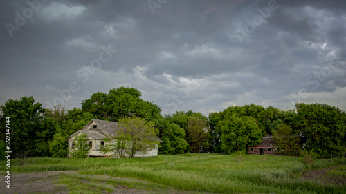 An old house tucked back in the woods on the Great Plains