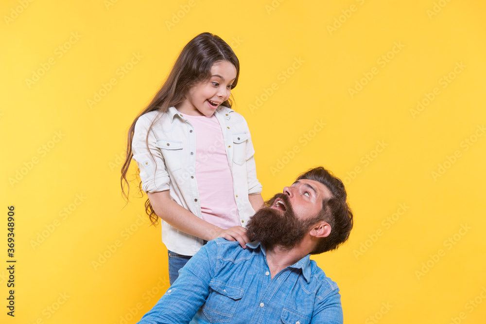 Obraz premium Father and happy little daughter having fun, surprise concept