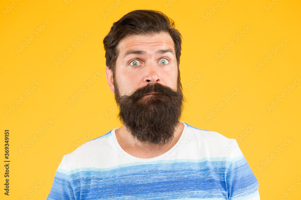 Have some doubts. Hipster bearded face not sure. Doubtful bearded man on yellow background close up. Doubtful expression. Cunning face. Interesting idea. Guy thinking. On his mind. Another idea Have some doubts. Hipster bearded face not sure. Doubtful bearded man on yellow background close up. Doubtful expression. Cunning face. Interesting idea. Guy thinking. On his mind. Another idea