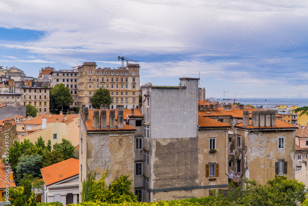 Panoramic horizontal view of Trieste, Italy with traditional houses and residential blocks from San Giusto hill