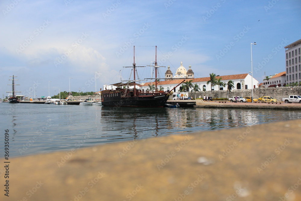 Beautiful view of the port of Cartagena - Old wooden ship - Colonial buildings within the walled city.