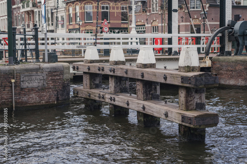 wooden supports on a water canal in the Netherlands