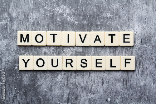 Motivational phrase Motivate yourself formed with plastic letters 