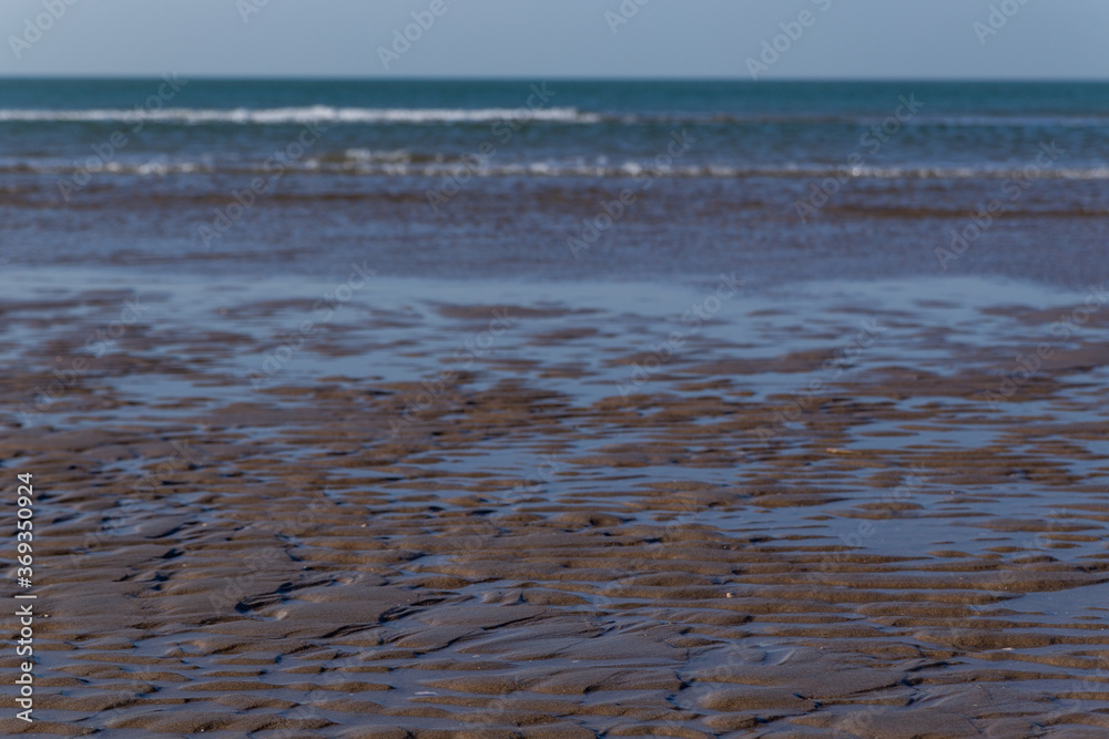 beautiful view of the North Sea, wet sand, waves, blue sky beautiful view of the North Sea, wet sand, waves, blue sky