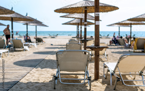 Half-empty beach bar during coronavirus pandemic in Greece