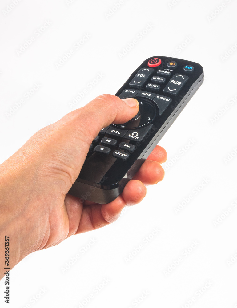 hand holding a remote control on white background, close-up hand holding a remote control on white background, close-up