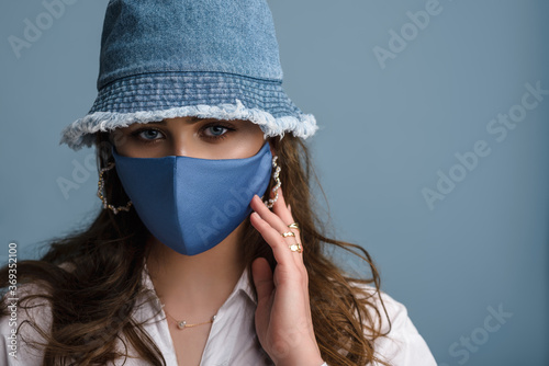 Premium Photo  A woman wearing a face mask and a hat