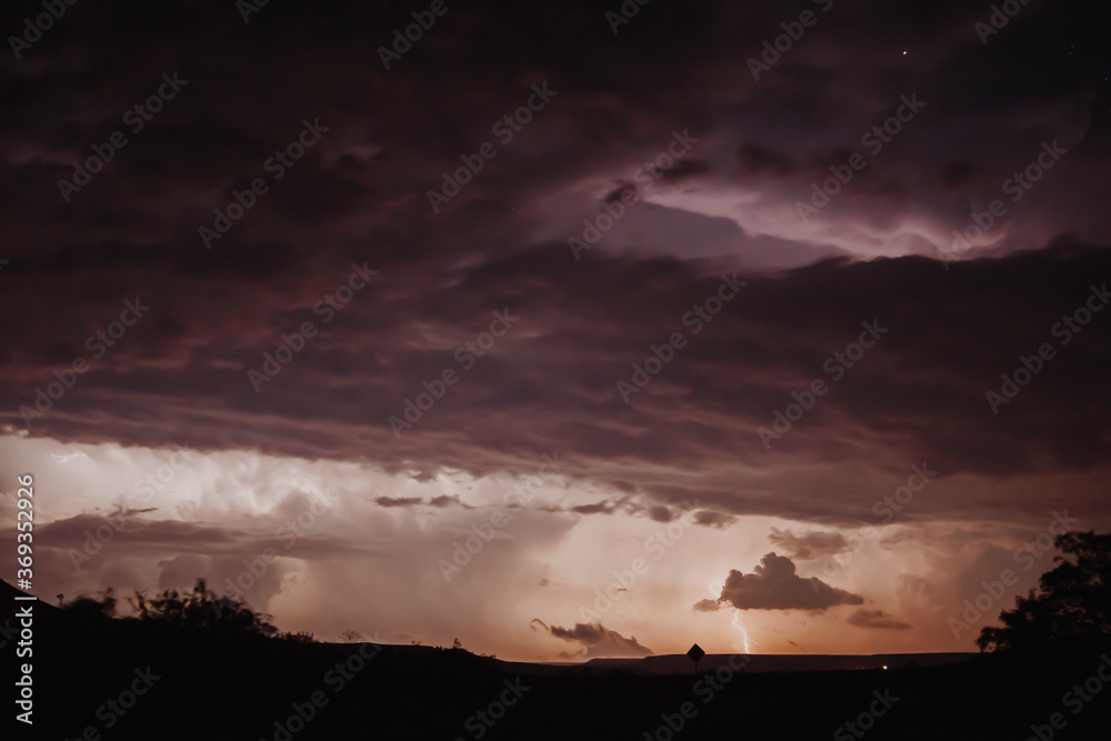 landscape at night with storm clouds and lightning