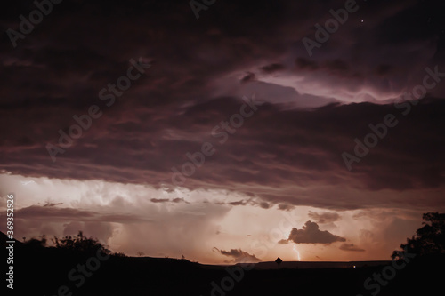 landscape at night with storm clouds and lightning