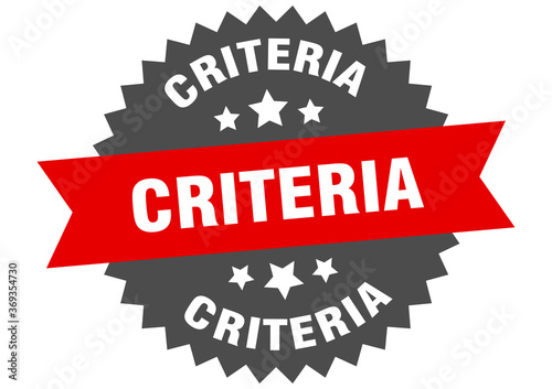 criteria round isolated ribbon label. criteria sign