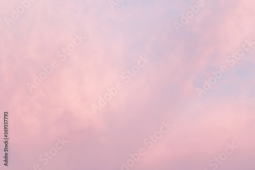 soft pastel pink evening sky with couds