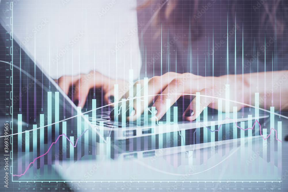 Double exposure of woman hands typing on computer and forex chart hologram drawing. Stock market invest concept.