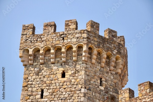 tower of the castle against blue sky
