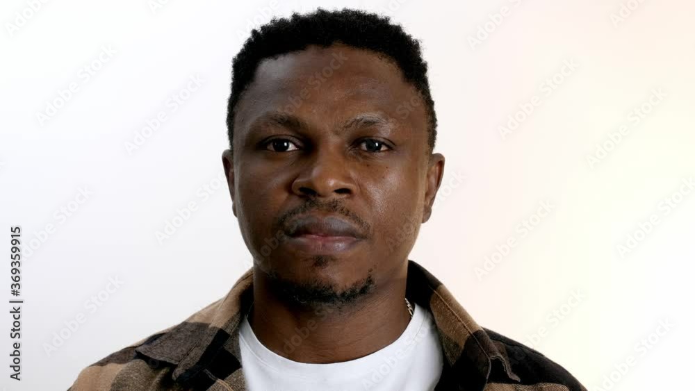 African-American man on white background. Problem of racism African-American man on white background. Problem of racism