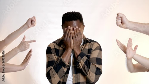 People bullying African-American man on white background. Stop racism