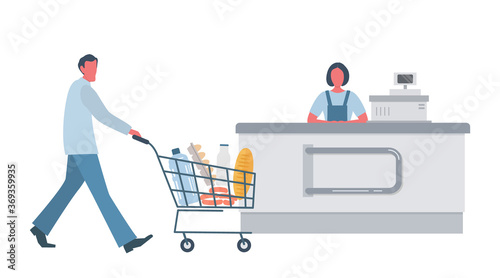 Supermarket shopper near the checkout. He's carrying a shopping cart full of food and drinks. Supermarket cashier behind the cash register. Vector ilustration in flat style