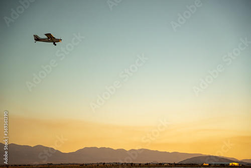 Private plan flying over El Mirage dry lakebed in California