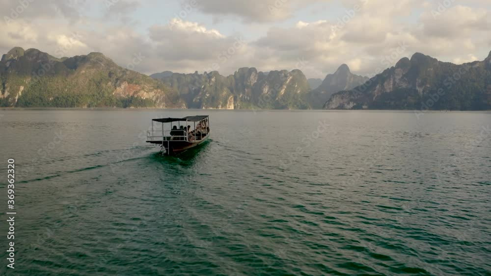 Drone shot of a boat ride in the Koh Sok national park in Thailand. Drone shot of a boat ride in the Koh Sok national park in Thailand.