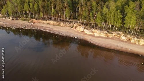 Red sandstone cliffs at Baltic sea coast Veczemju klintis aerial view photo