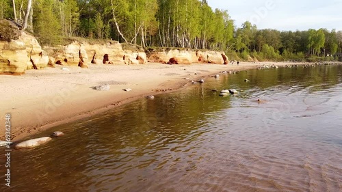 Red sandstone cliffs at Baltic sea coast Veczemju klintis aerial view photo