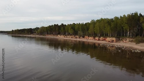 Red sandstone cliffs at Baltic sea coast Veczemju klintis aerial view photo