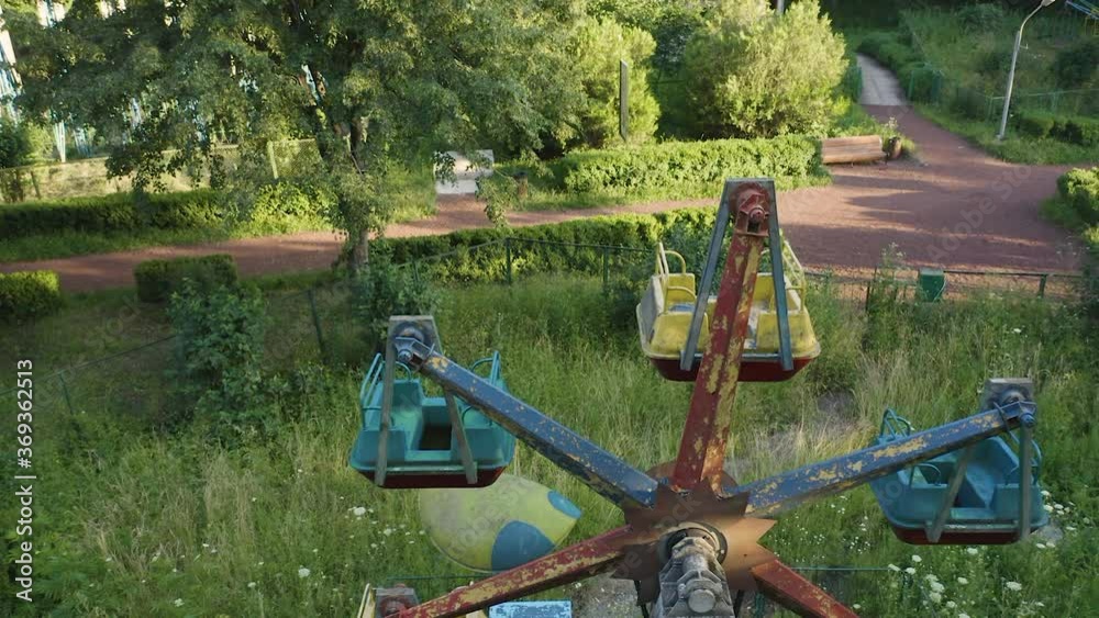Abandoned Ferris wheel lies within a derelict amusement park in Armenia. Abandoned Ferris wheel lies within a derelict amusement park in Armenia.