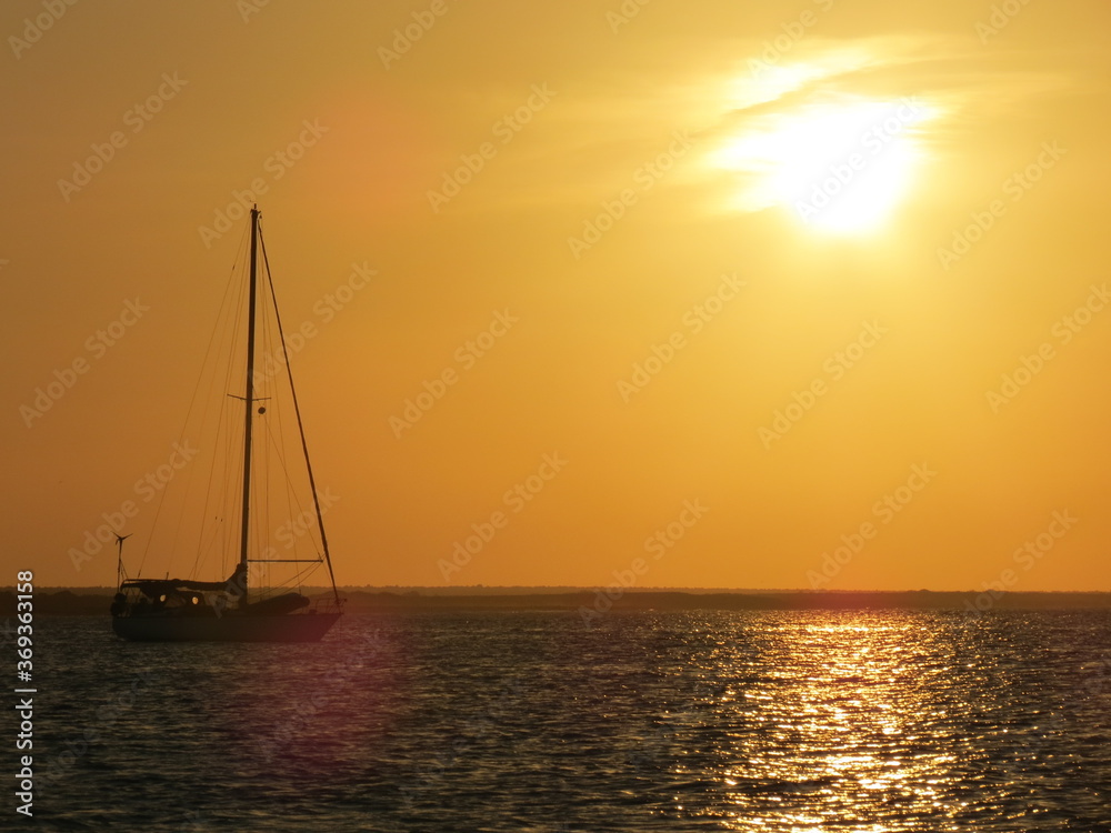 Sunset with sailboat in Isla la Tortuga