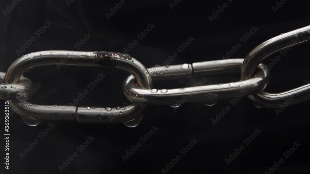Weakest Link - Concept - Real Chain slowly heats up and starts to sparkle, then the weakest link finally breaks and then the rest of the chain breaks.