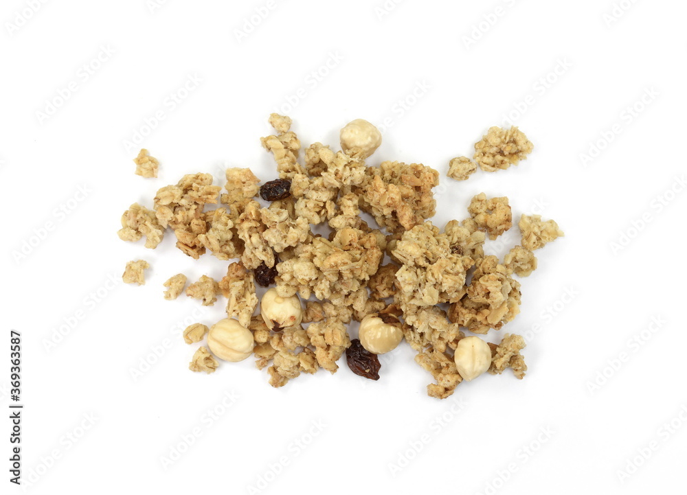 Pile of granola from above isolated on a white background. CRUNCHY hazelnut muesli isolated. Pile of granola from above isolated on a white background. CRUNCHY hazelnut muesli isolated.