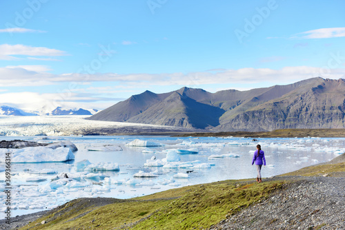 Fényképezés Iceland travel tourist enjoying view of nature landscape Jokulsarlon glacial lagoon / glacer lake on Iceland