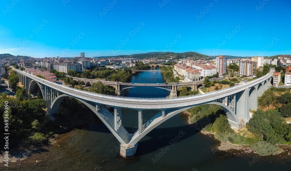 aerial view of the skyline of the Galician city of Ourense from the river Miño