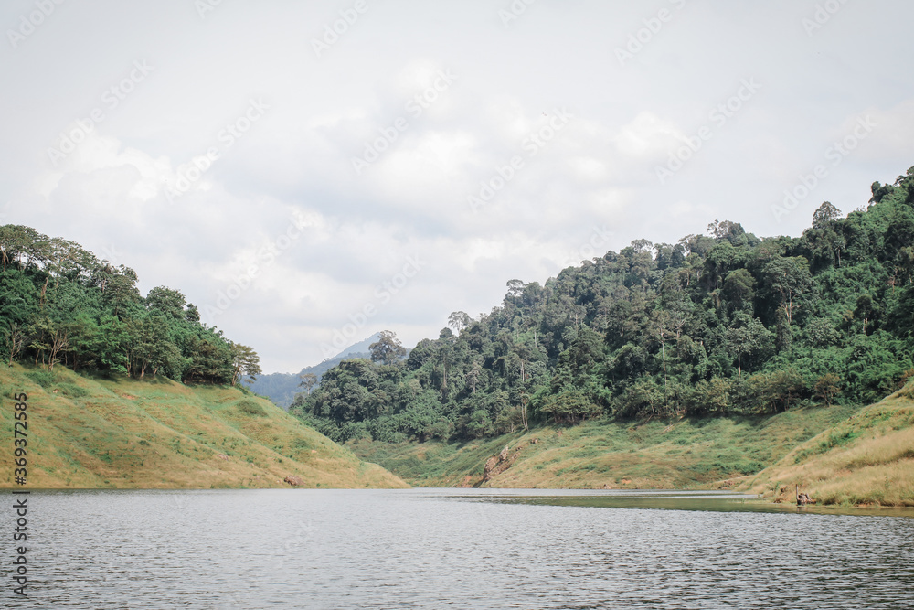 Panoramic view of beautiful lake and mountain landscape fresh green valley at Khun Dan Prakan Chon Dam Nakhon Nayok Thailand.Deep forest lake shore in rainy day. Panoramic view of beautiful lake and mountain landscape fresh green valley at Khun Dan Prakan Chon Dam Nakhon Nayok Thailand.Deep forest lake shore in rainy day.