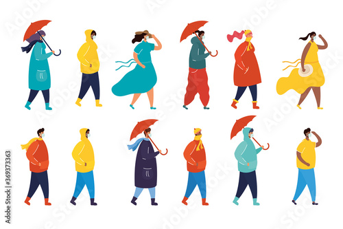 interracial young people wearing medical masks with seasonal clothes