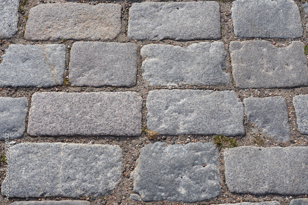 Texture of stone pavement tiles on a road. Texture of stone pavement tiles on a road.
