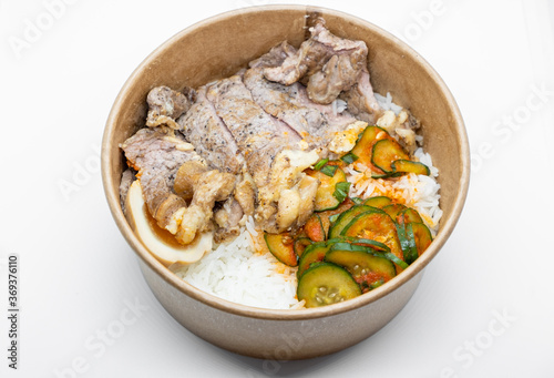 Closed up of take away rice box, lunch box in hard paper bowl on white background