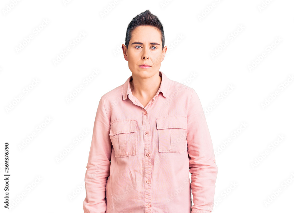 Young woman with short hair wearing casual clothes relaxed with serious expression on face. simple and natural looking at the camera. Young woman with short hair wearing casual clothes relaxed with serious expression on face. simple and natural looking at the camera.