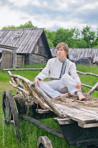 country boy sitting in an old cart