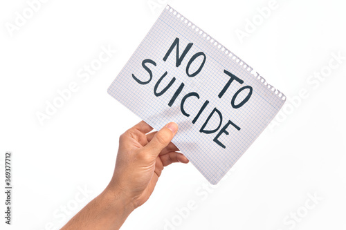 Cardboard banner with NO TO SUICIDE text over isolated white background