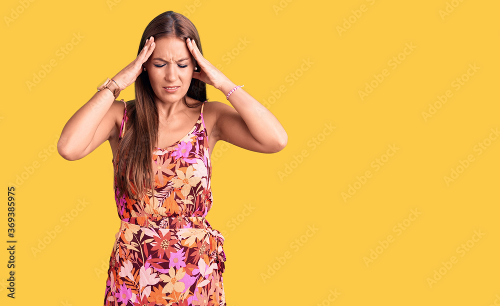 Young beautiful hispanic woman wearing casual clothes with hand on head, headache because stress. suffering migraine. Young beautiful hispanic woman wearing casual clothes with hand on head, headache because stress. suffering migraine.
