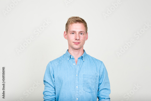 Portrait of young handsome businessman with blond hair