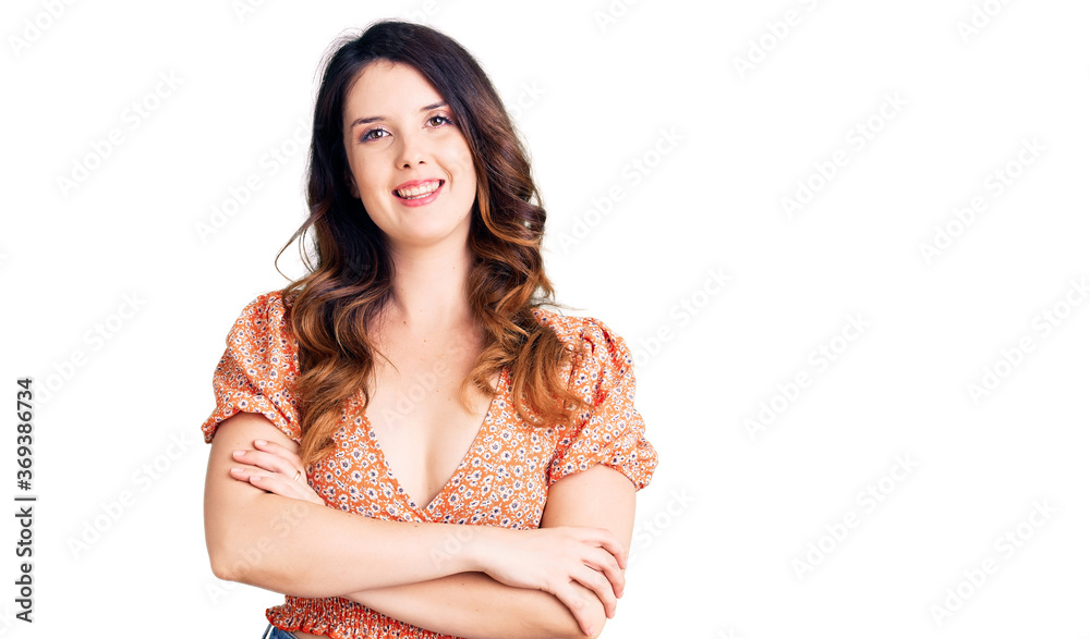 Beautiful young brunette woman wearing casual clothes happy face smiling with crossed arms looking at the camera. positive person. Beautiful young brunette woman wearing casual clothes happy face smiling with crossed arms looking at the camera. positive person.