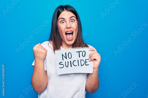 Bild auf Leinwand Young beautiful woman asking for psychical problem holding paper with not to sui